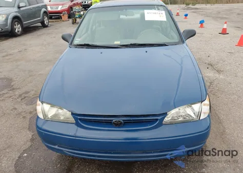 1999 Toyota Corolla Le z USA, uszkodzony, nr VIN 2T1BR12E9XC232710